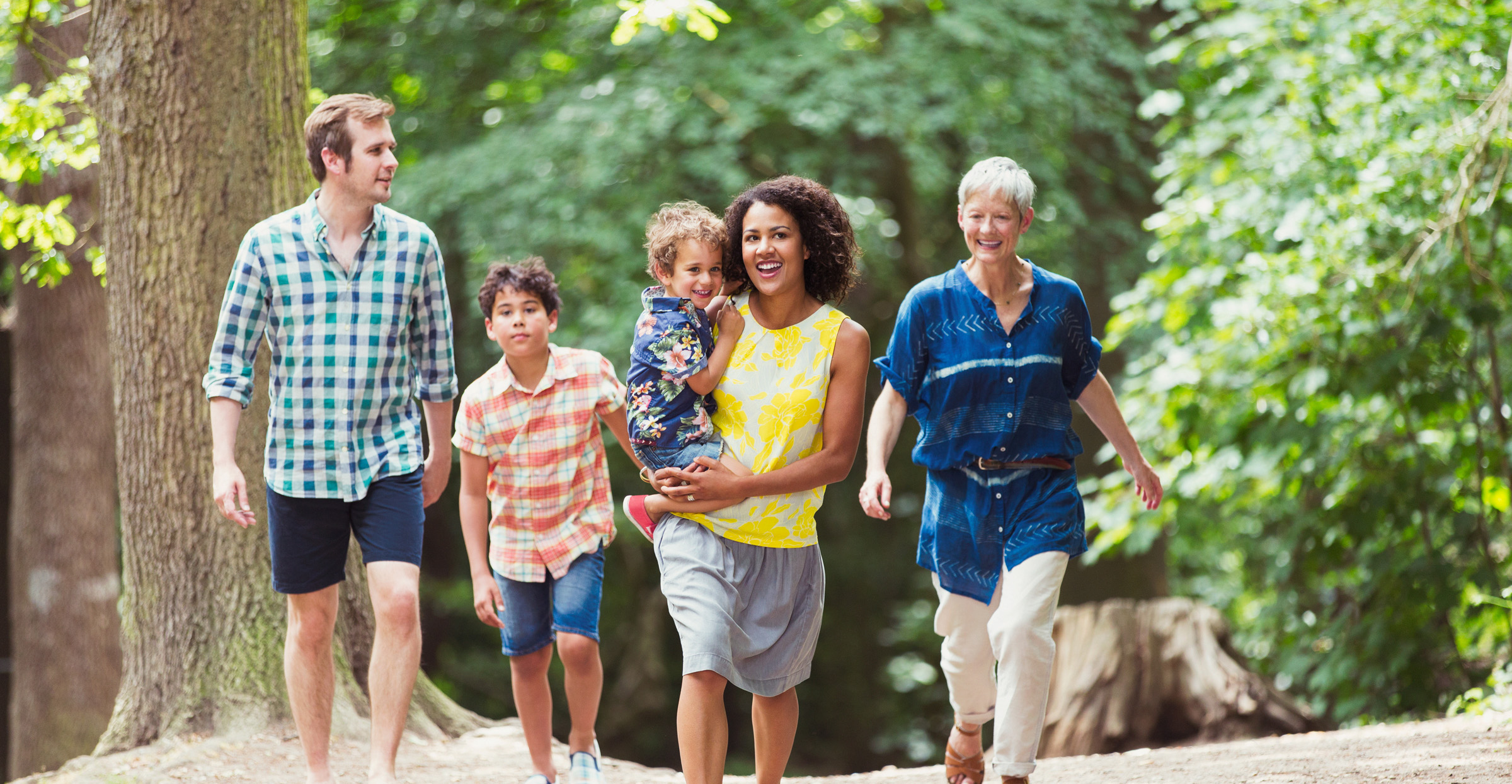 Happy family on a hike through the woods