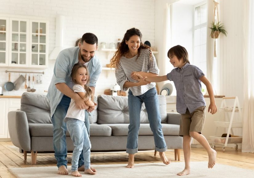 Family dancing in living room